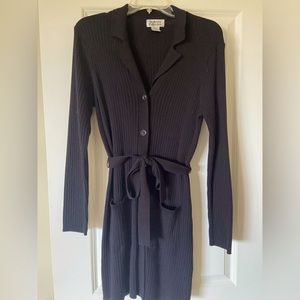 Black ribbed hip-length long-sleeve cardigan sweater with collar and self-tie